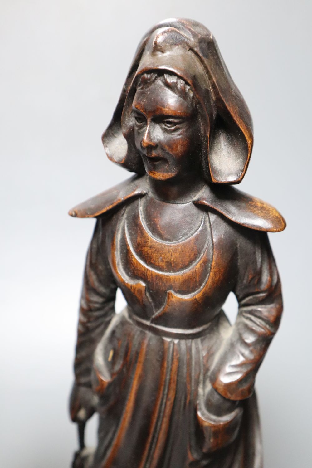 A set of three 19th century Dutch walnut figures of puritans, height 34cm